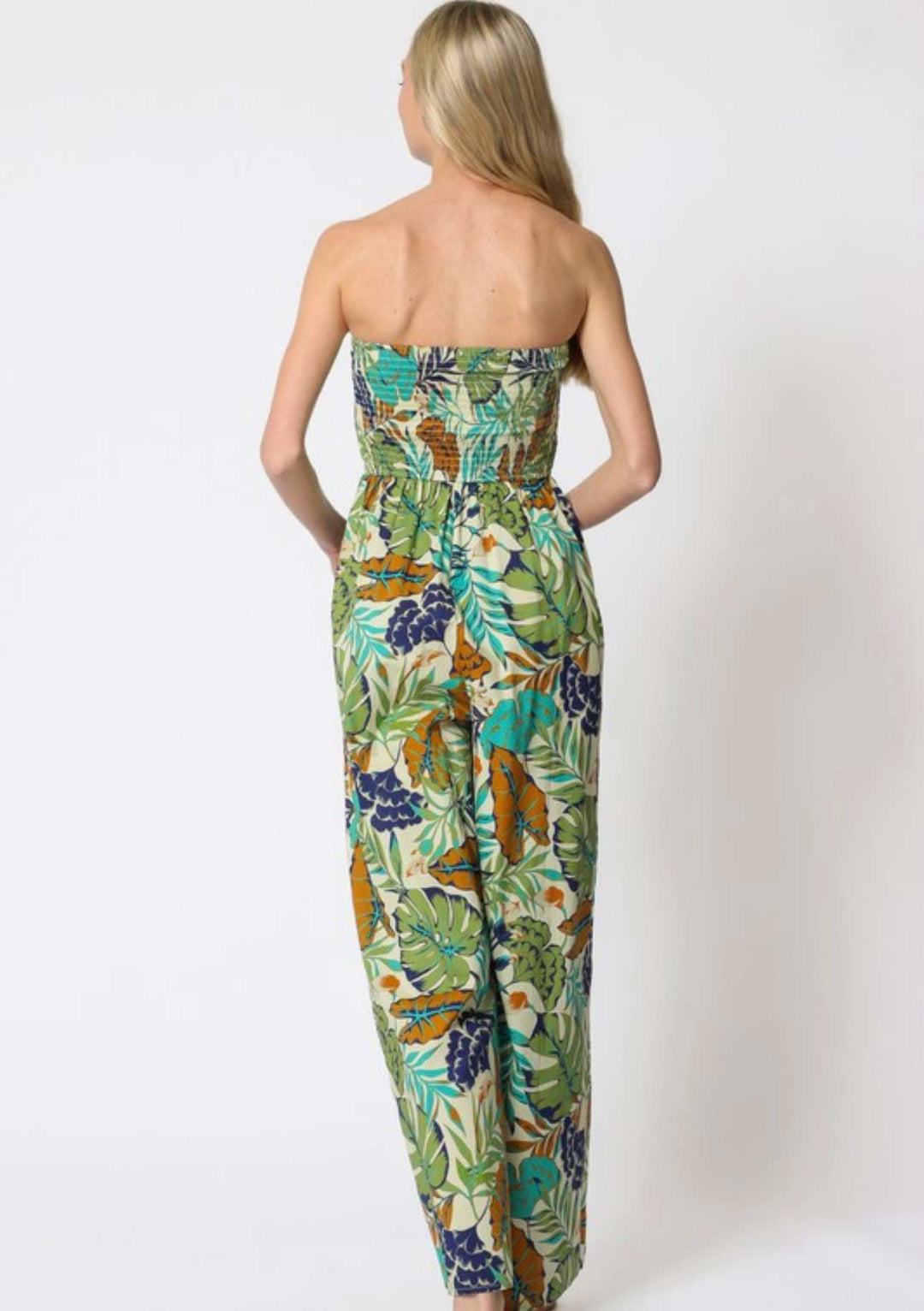 Women’s green strapless jumpsuit with palm leaf print – perfect vacation style
