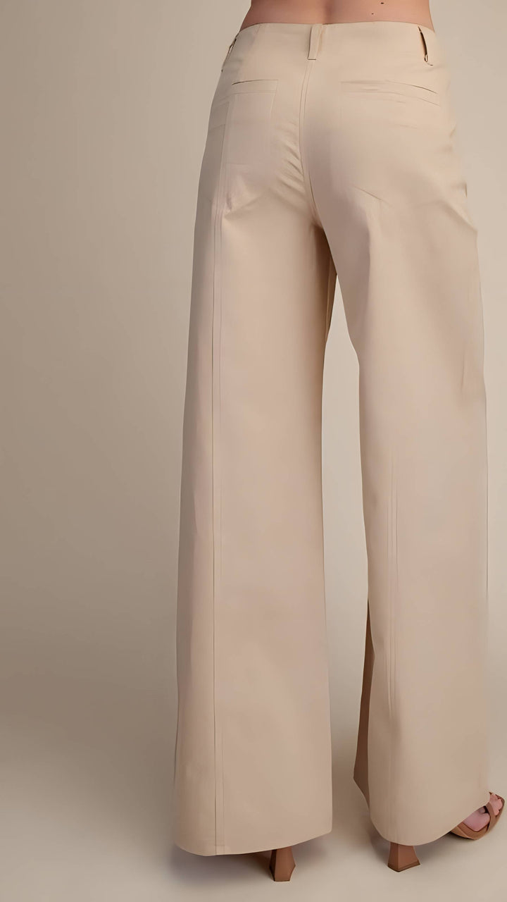 Beige wide-leg pants on a neutral background