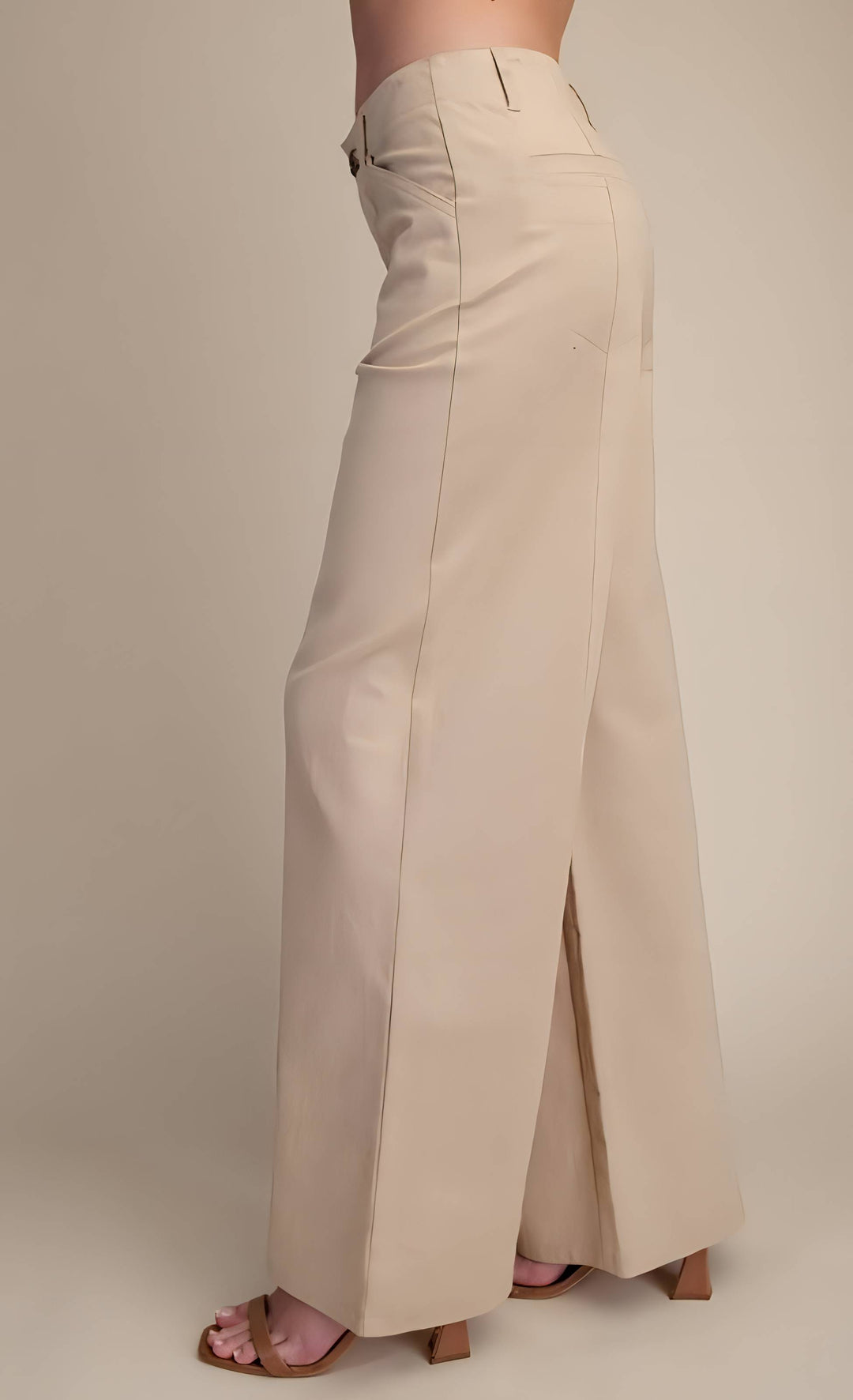 Beige wide-leg pants on a neutral background