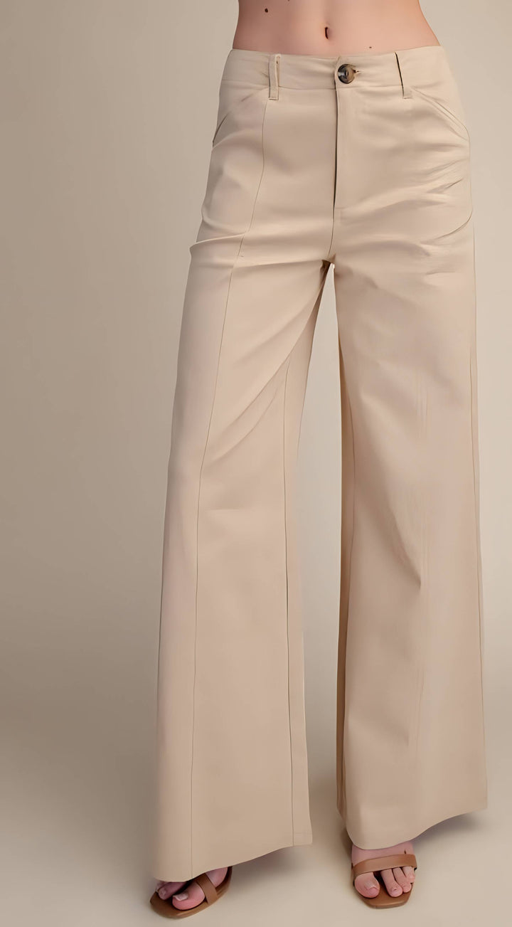 Beige wide-leg pants on a plain background