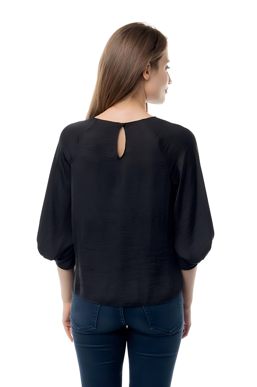 A woman viewed from the back wearing a black long-sleeve blouse with a small keyhole cutout at the neckline, paired with dark blue jeans, against a plain white background.