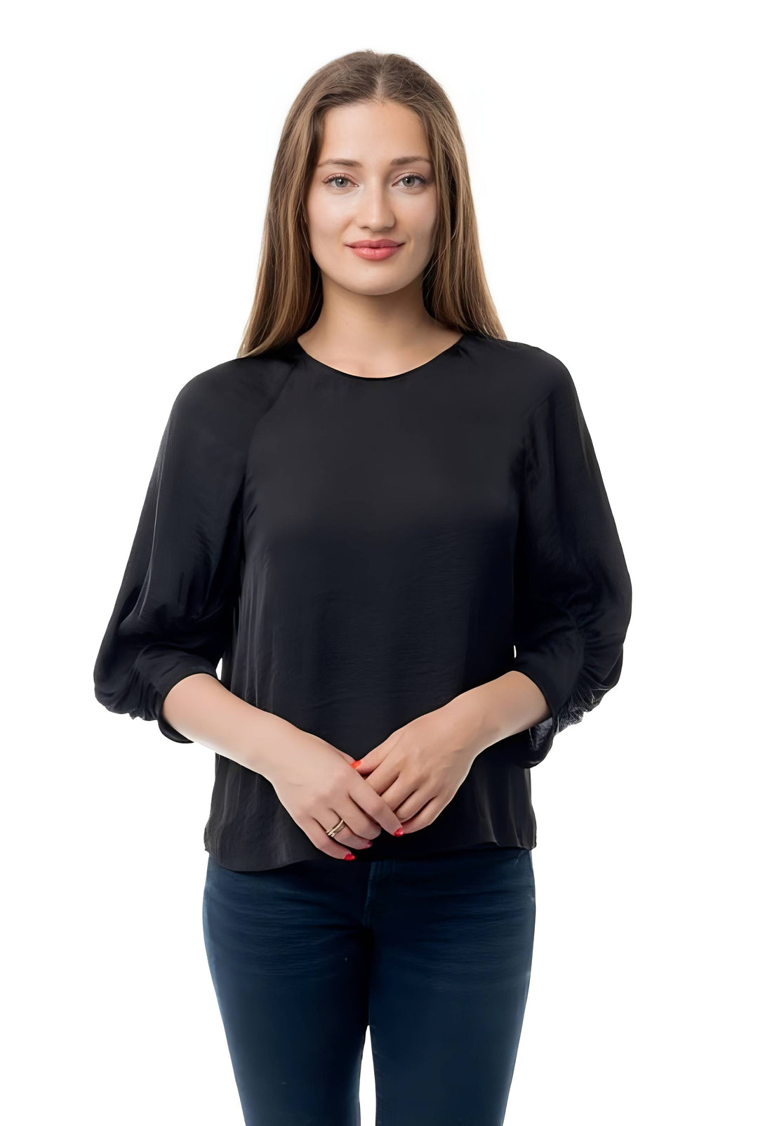 A woman modeling a black long-sleeve blouse with gathered elbow-length sleeves and a round neckline, paired with dark blue jeans, against a plain white background.