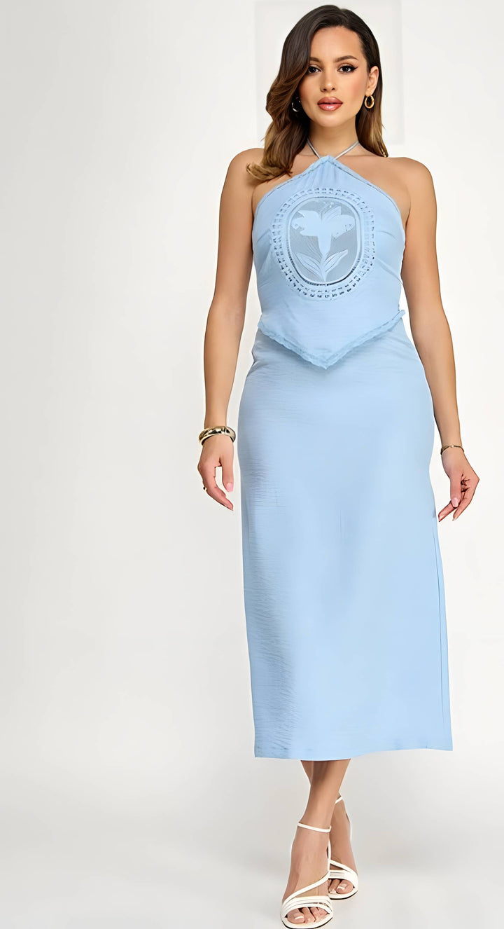 Light blue halter neck dress with intricate detailing on a white background