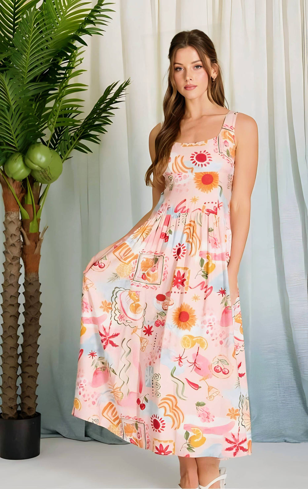 Woman wearing a colorful floral dress standing next to a potted plant with a white curtain background