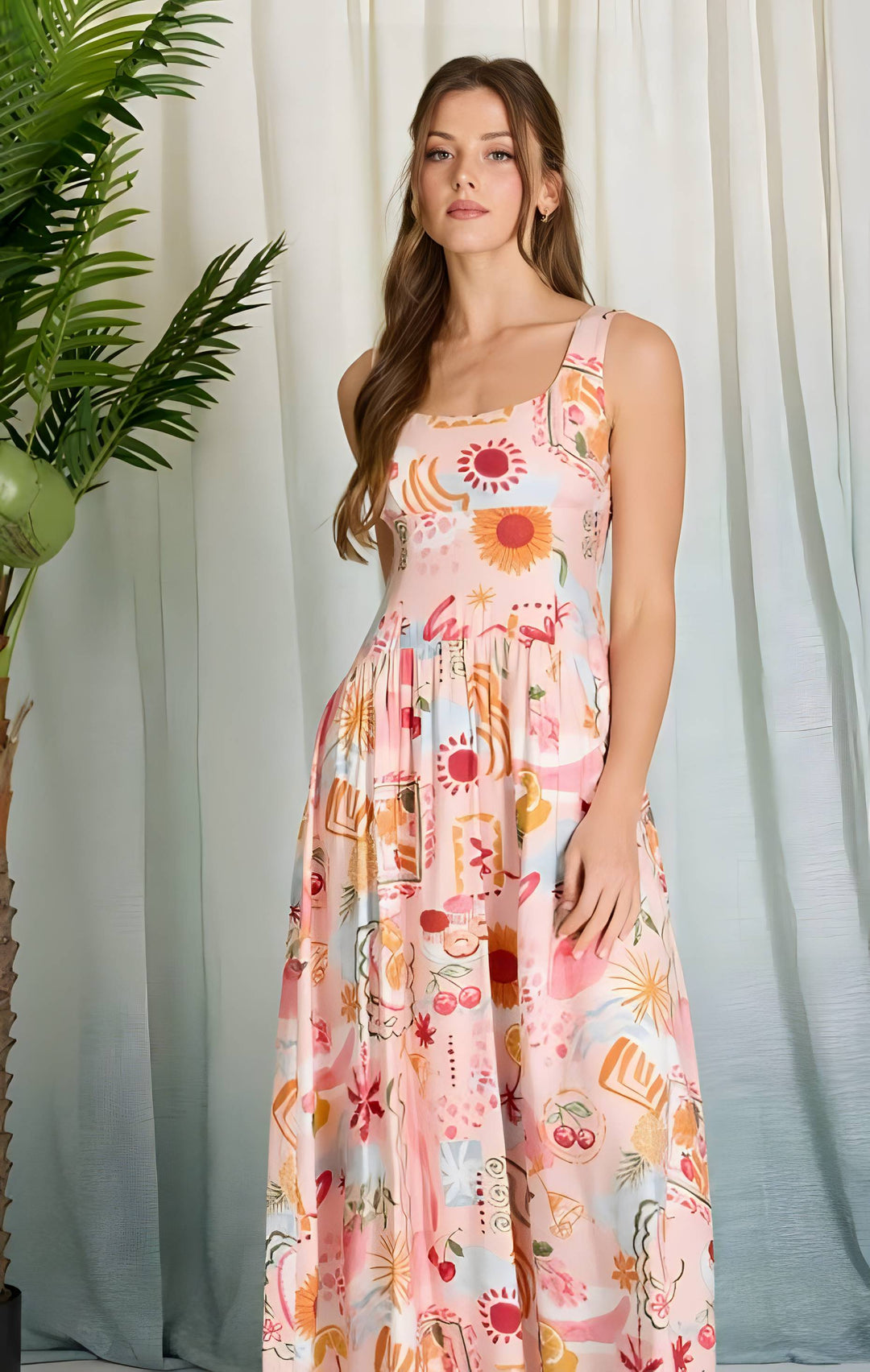 Woman wearing a floral dress standing against a white curtain