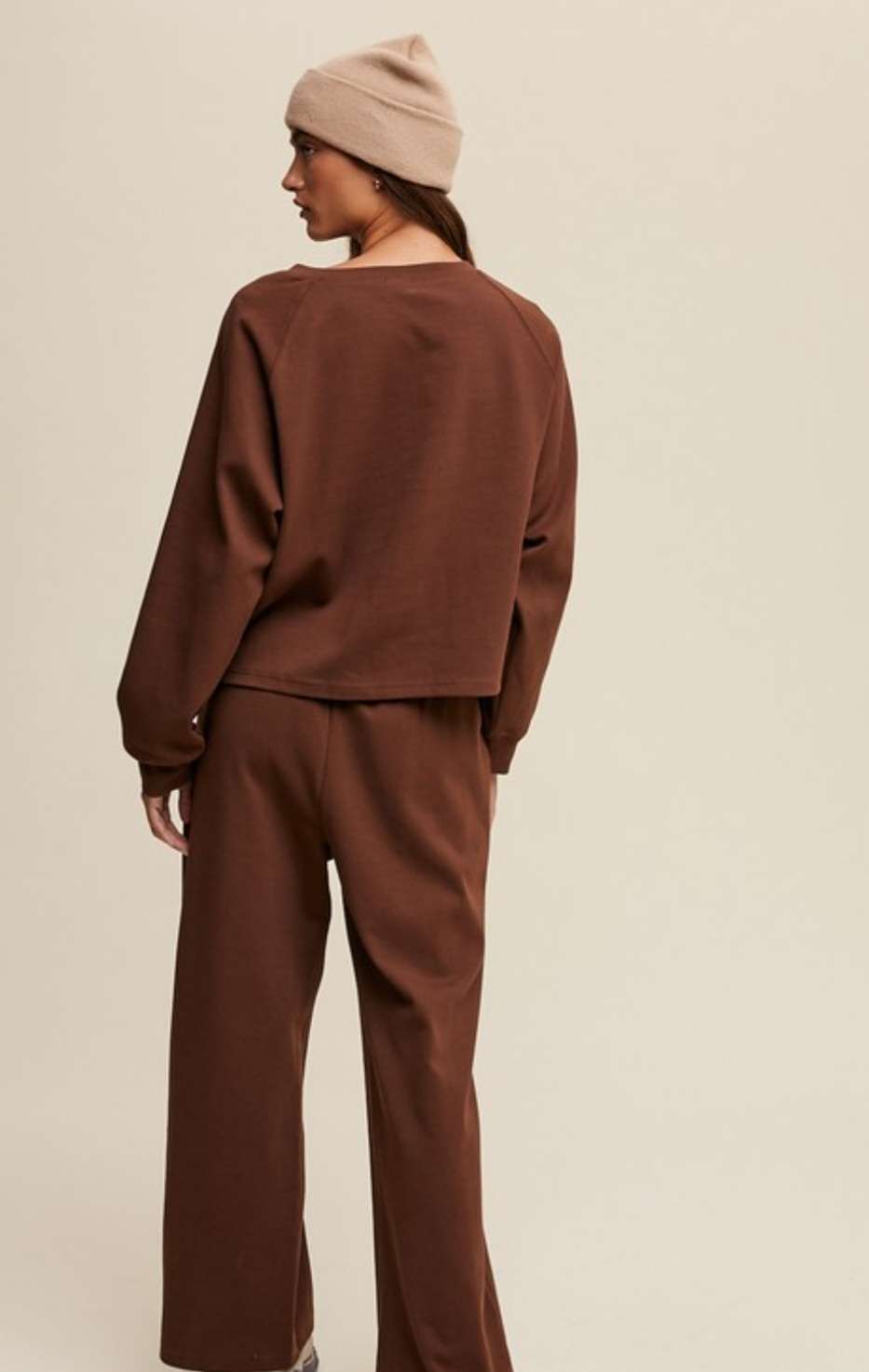 Two-piece brown lounge set featuring V-neck top and matching pants