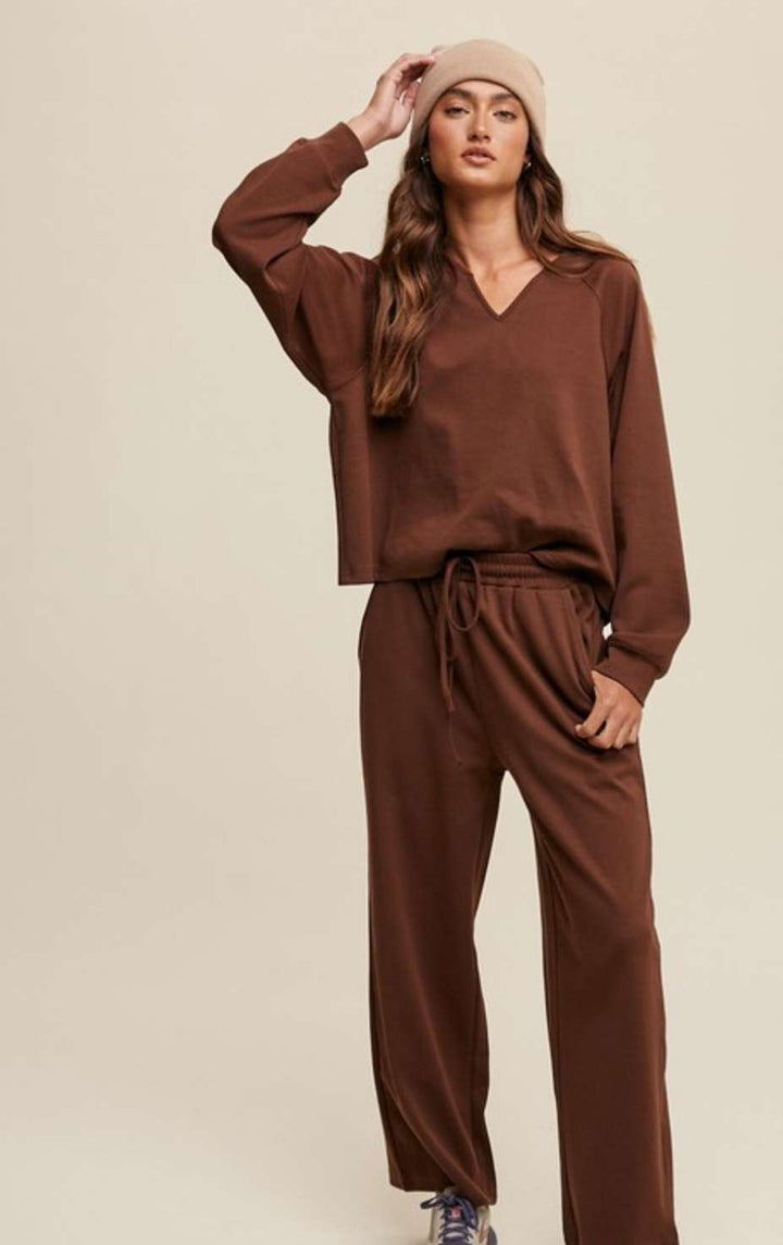Two-piece brown lounge set featuring V-neck top and matching pants