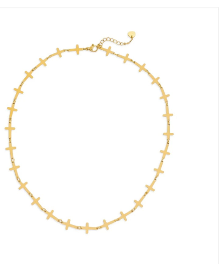 Gold necklace with cross pendants on a white background