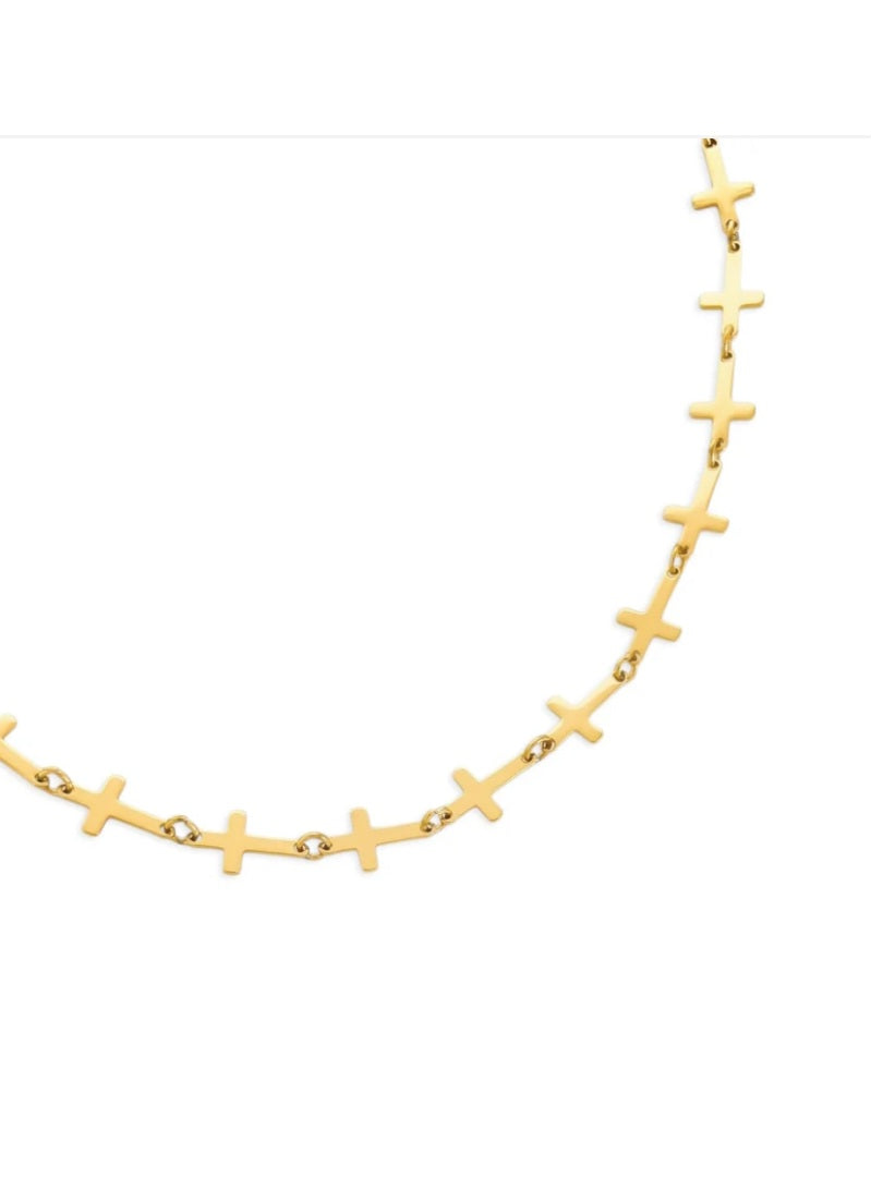Gold necklace with cross pendants on a white background