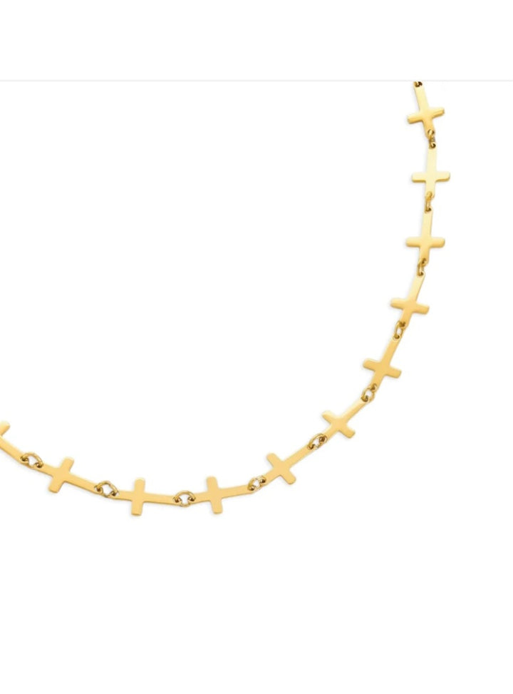 Gold necklace with cross pendants on a white background