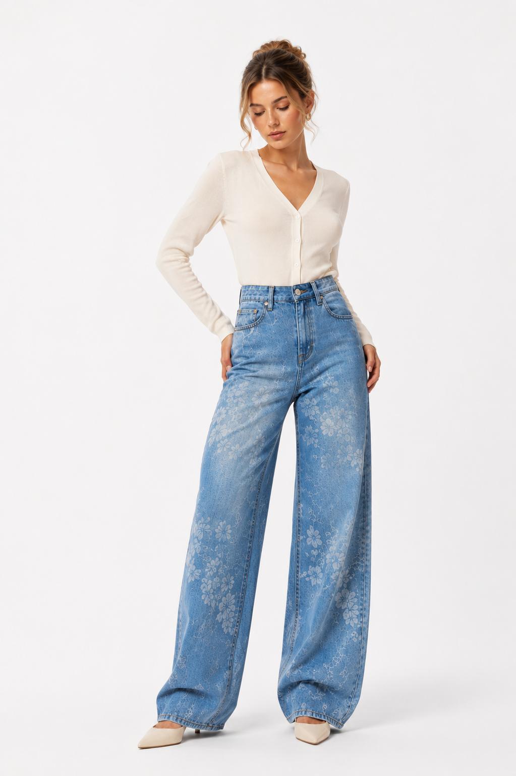 Woman wearing a white long-sleeve top and blue jeans on a white background