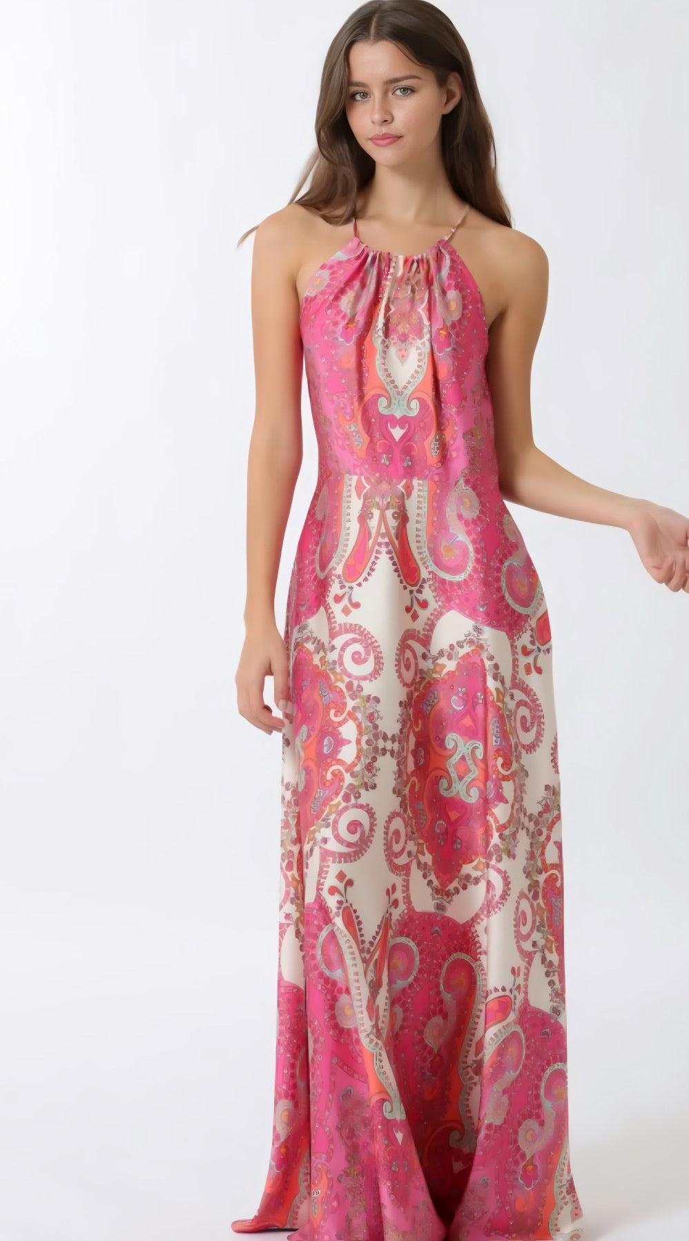 Woman wearing a pink and white patterned dress on a white background