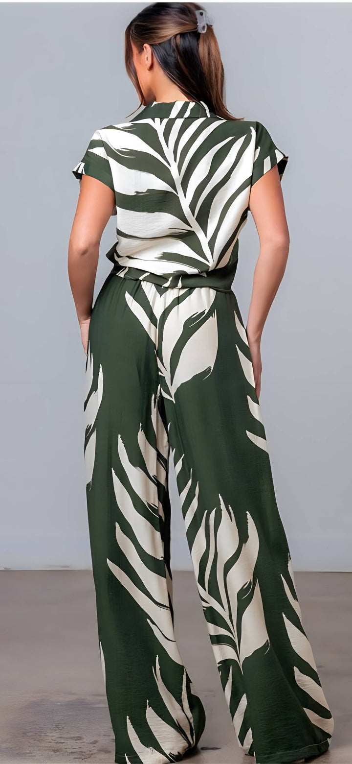 Person wearing a green and white patterned outfit against a gray background