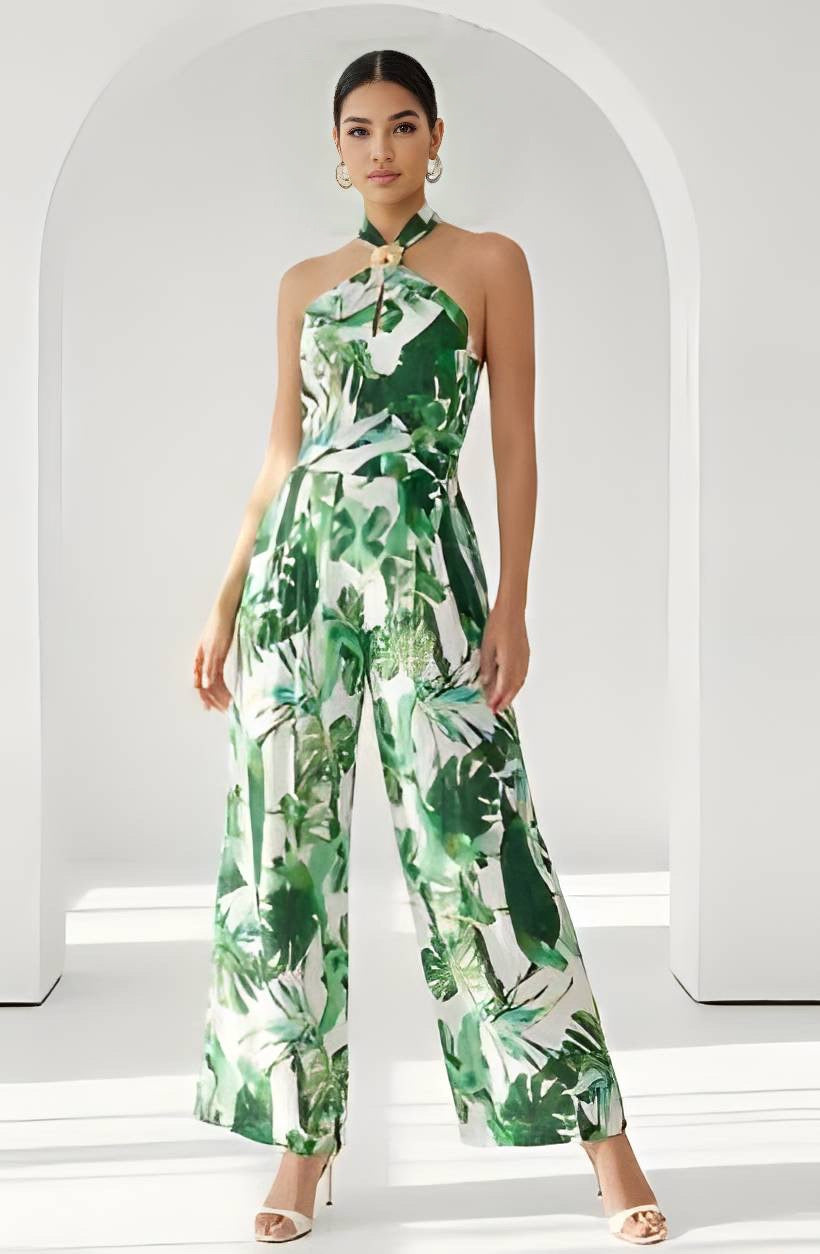 Woman wearing a green and white floral jumpsuit in a minimalistic setting