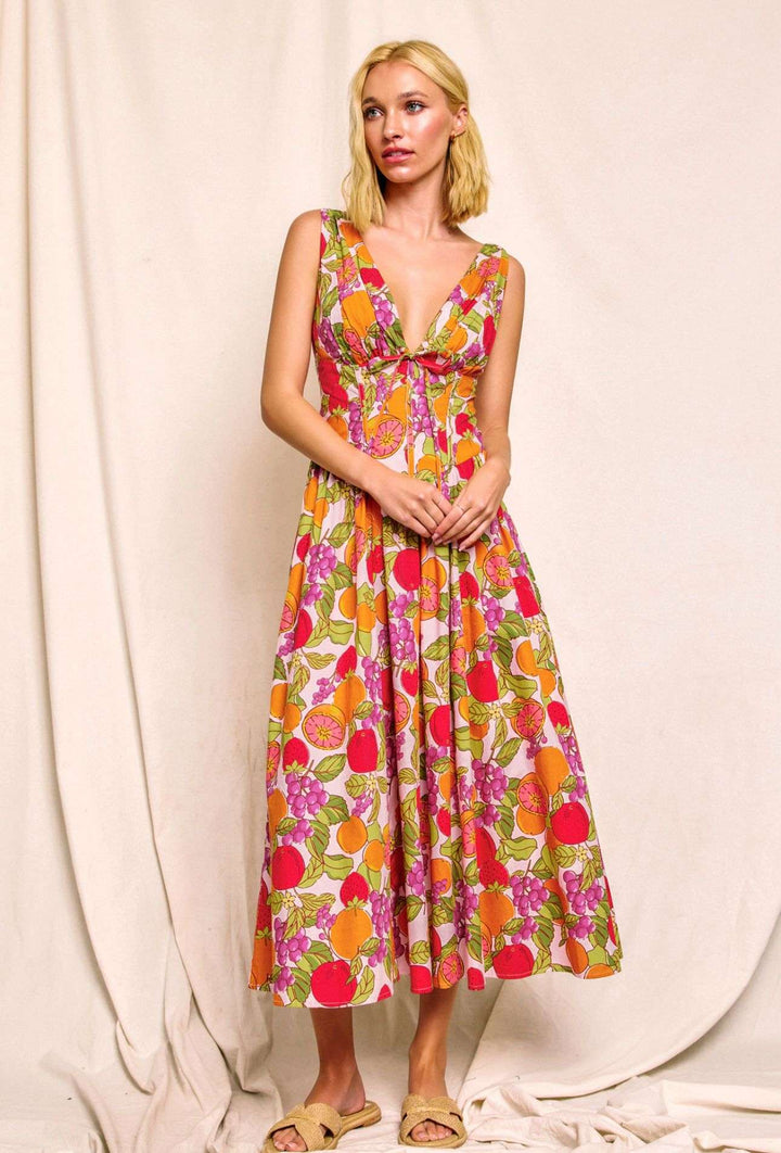 Women's orange tropical fruit print dress, sleeveless summer outfit with vibrant vacation style