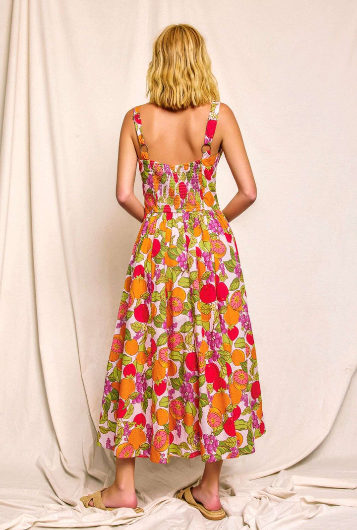 Women's orange tropical fruit print dress, sleeveless summer outfit with vibrant vacation style