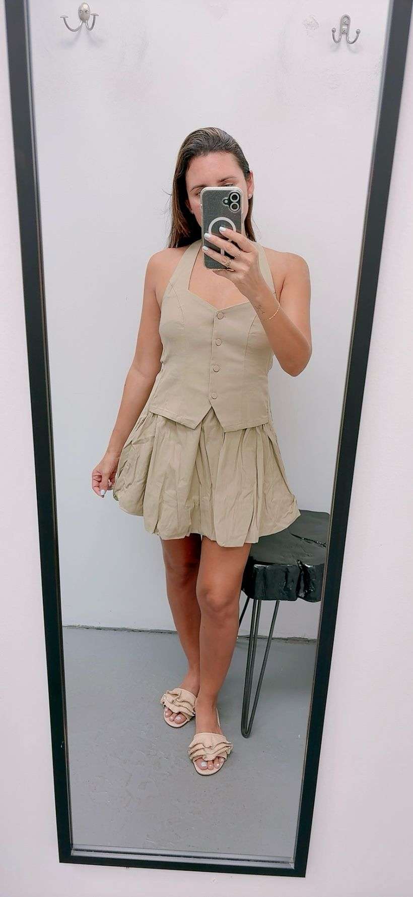Stylish beige halter vest-style dress with unique bubble hem silhouette