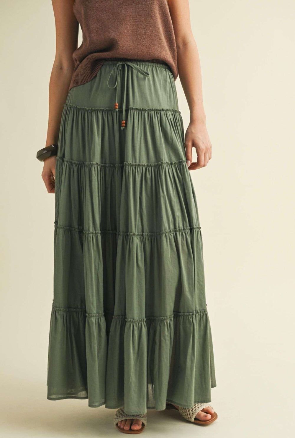 Flowy olive tiered maxi skirt for women – boho-inspired long skirt with layered design, perfect for casual wear, summer outfits, and vacation style.