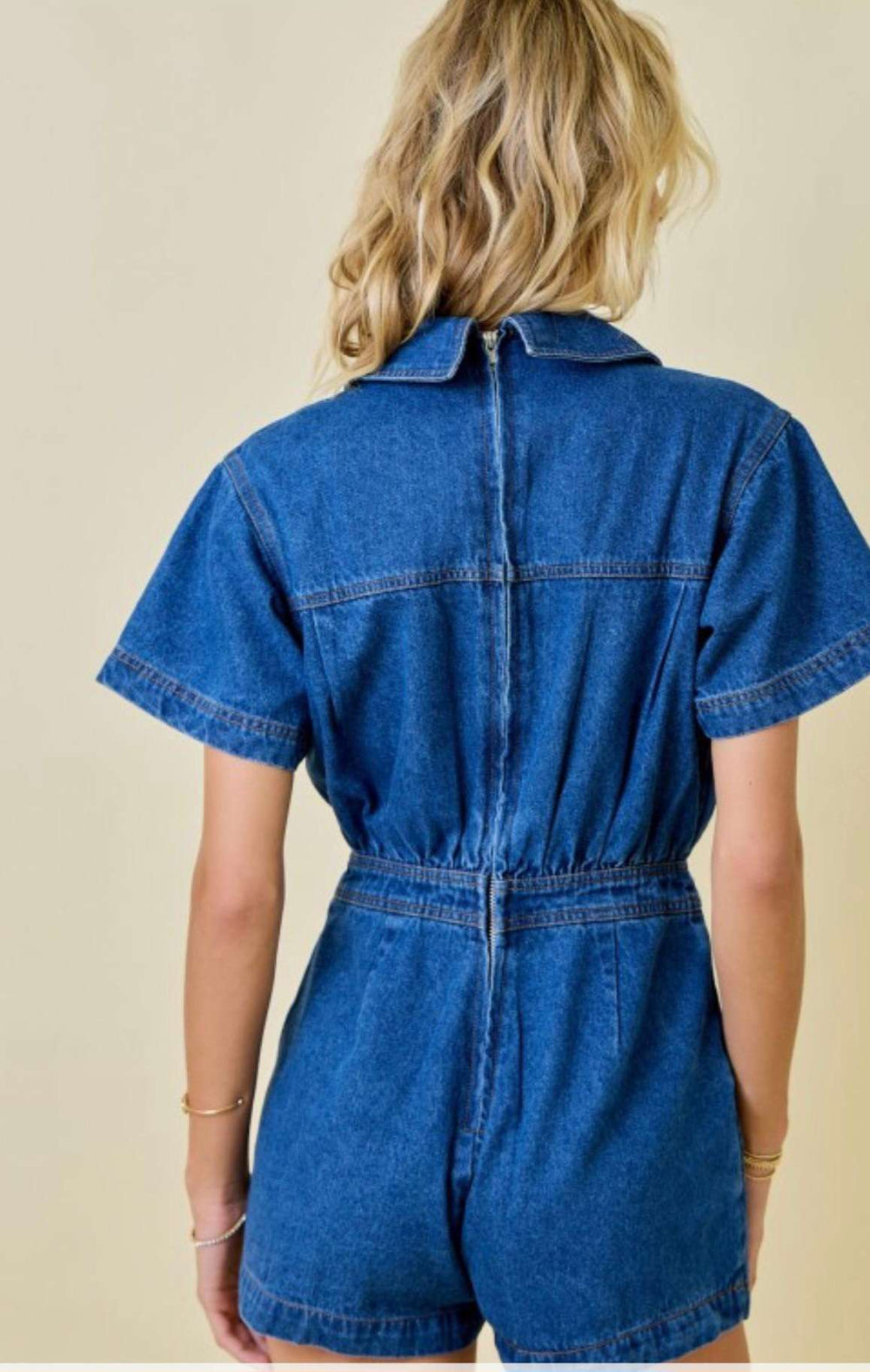 Women's denim skort romper with back zipper closure and skirt overlay