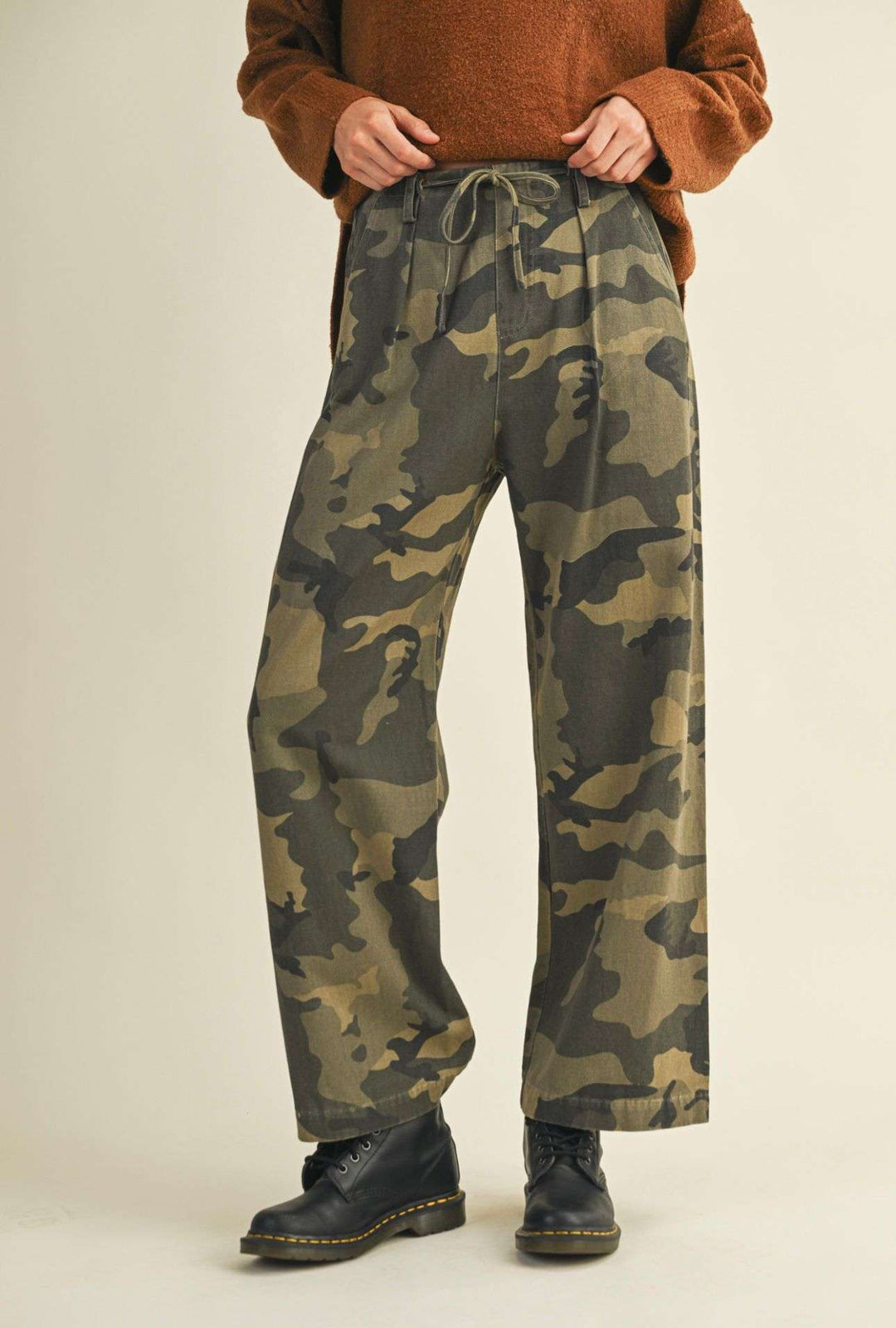 Women’s camo front tie pants with adjustable waist and relaxed fit.