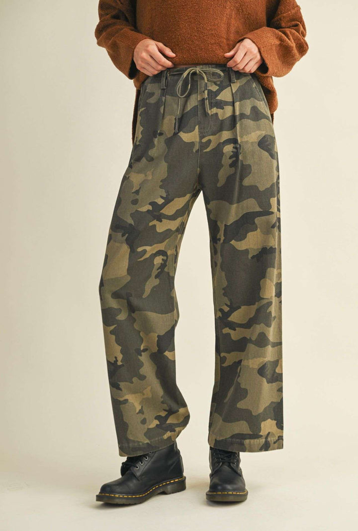 Women’s camo front tie pants with adjustable waist and relaxed fit.
