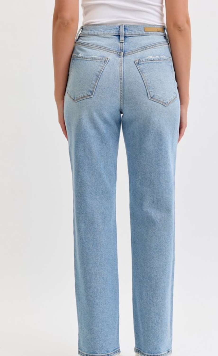 Women's light denim high rise jeans with a slim fit and classic five-pocket design, perfect for casual everyday wear.