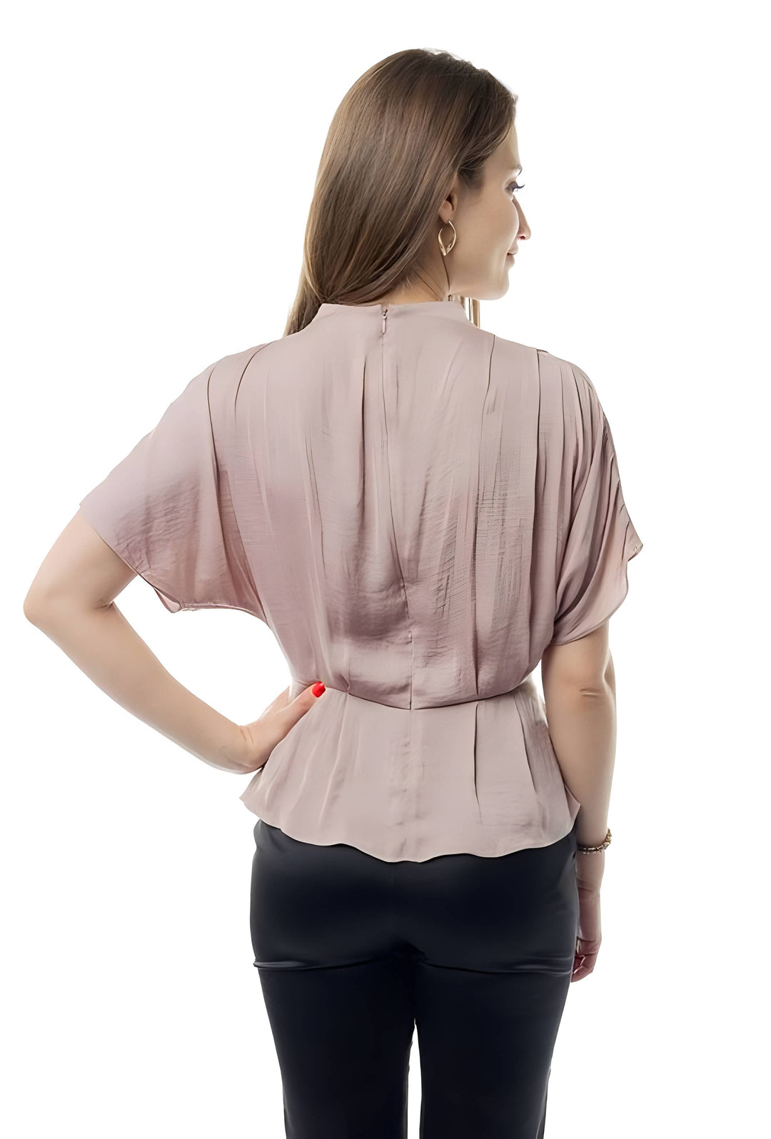 A woman shown from the back wearing a short-sleeve dusty rose peplum blouse and black pants against a white studio background.