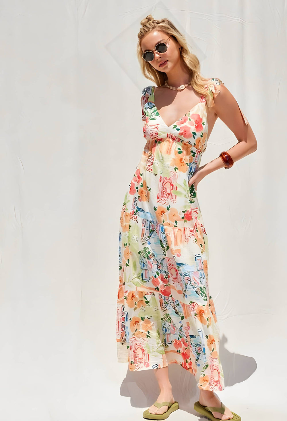 Woman wearing a floral dress against a white background