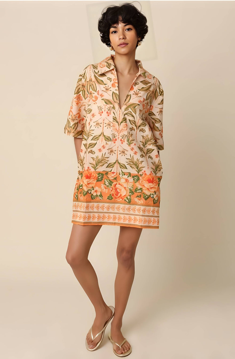 Woman wearing a floral dress with a neutral background