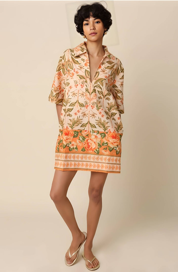 Woman wearing a floral dress with a neutral background