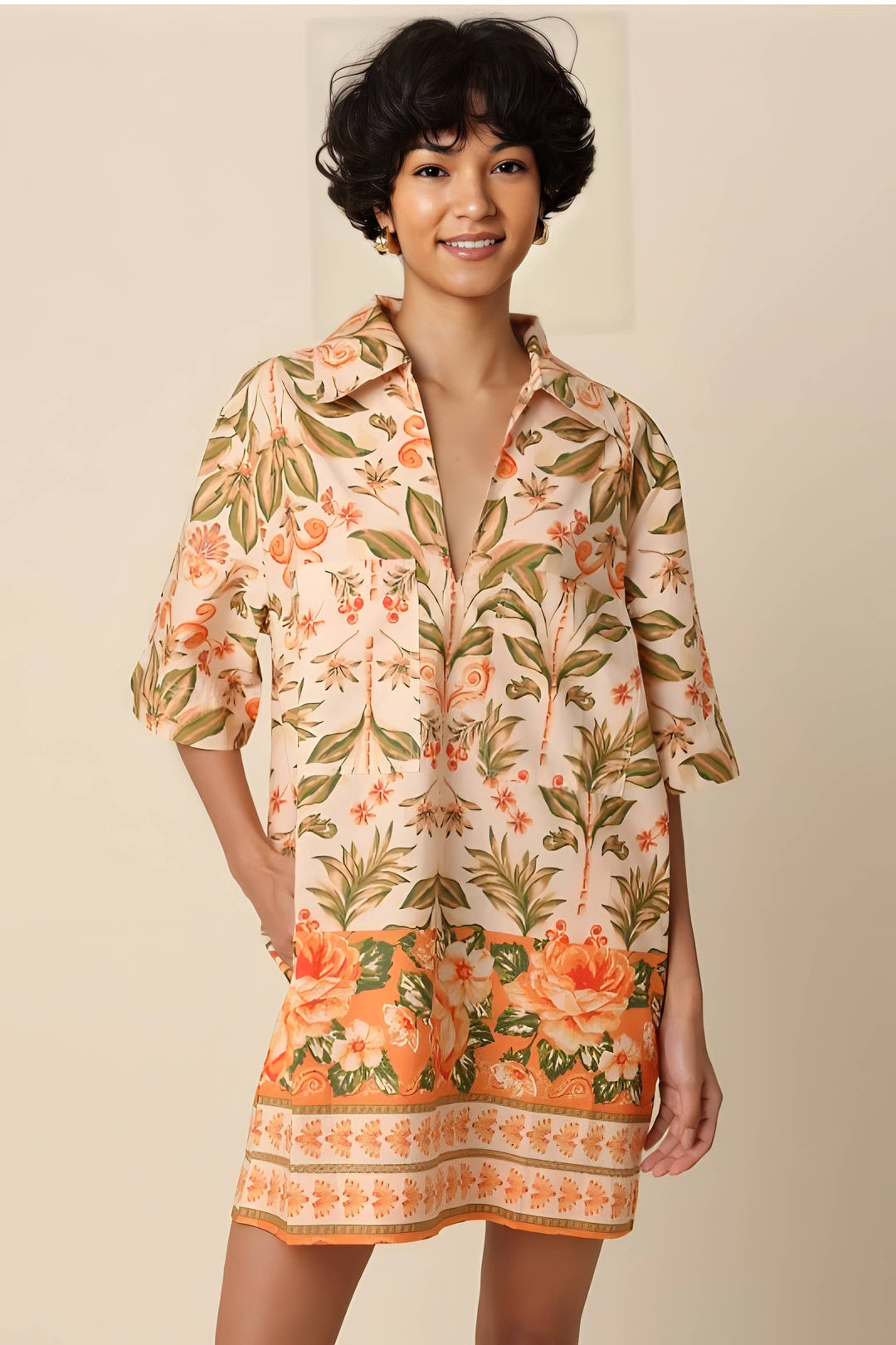 Woman wearing a floral dress with a plain background