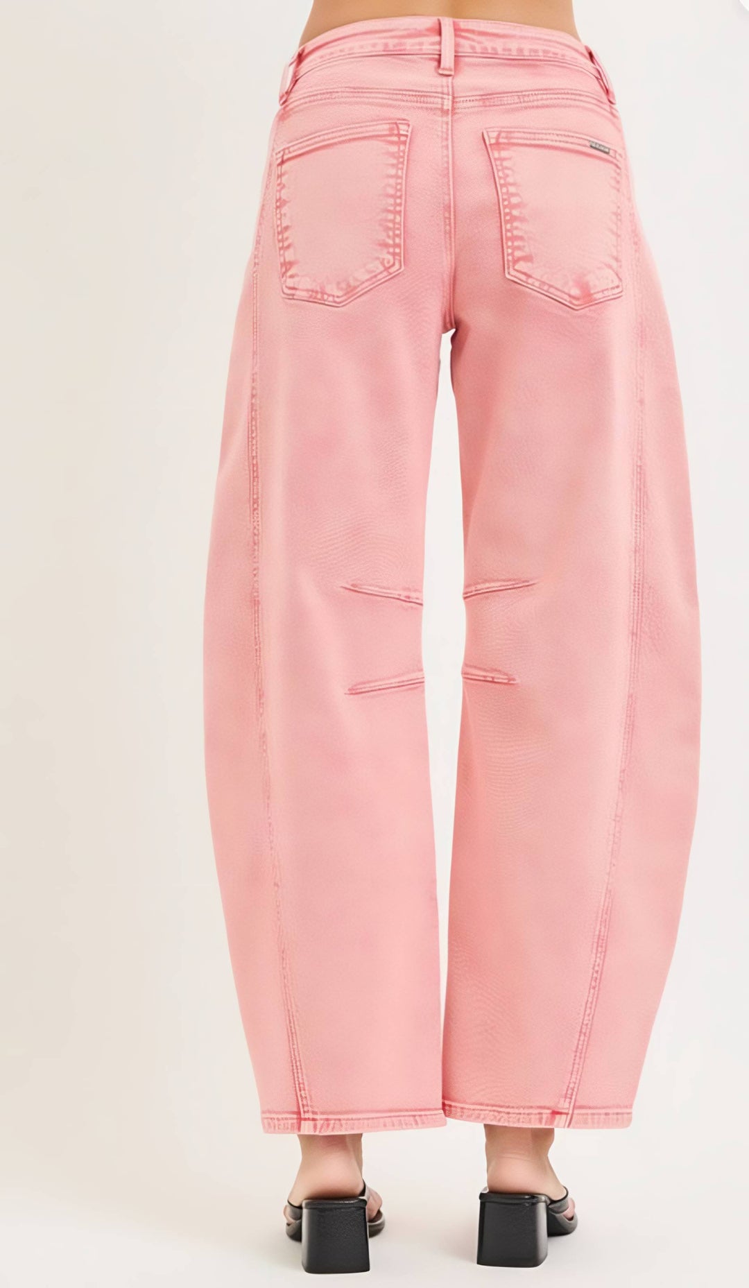 Pink jeans on a beige background