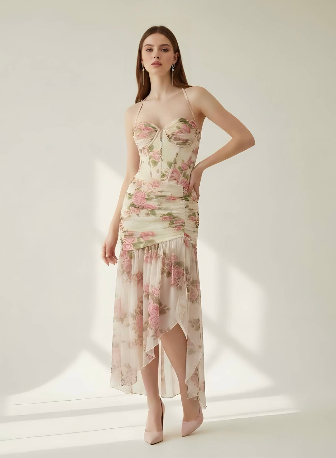 Woman wearing a floral dress against a white background