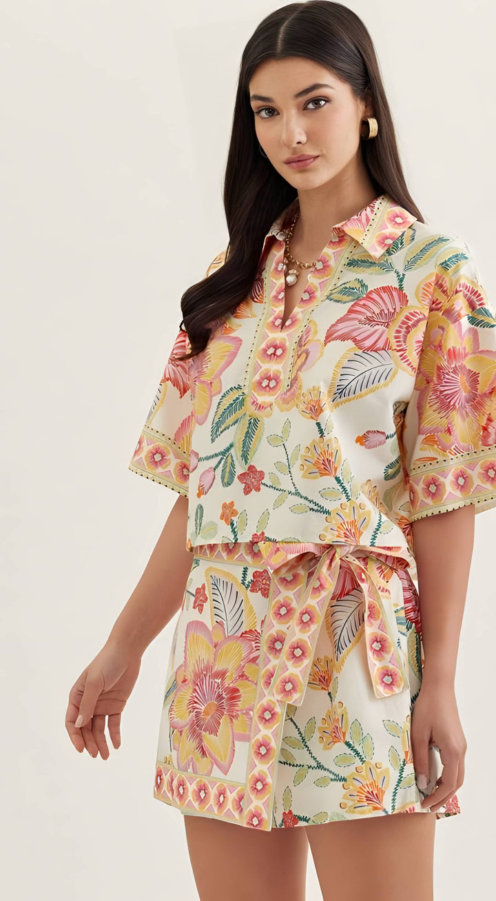 Woman wearing a floral outfit on a white background