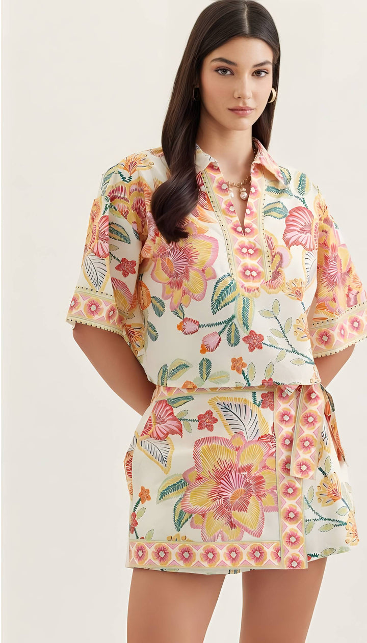Woman wearing a floral dress with a plain background