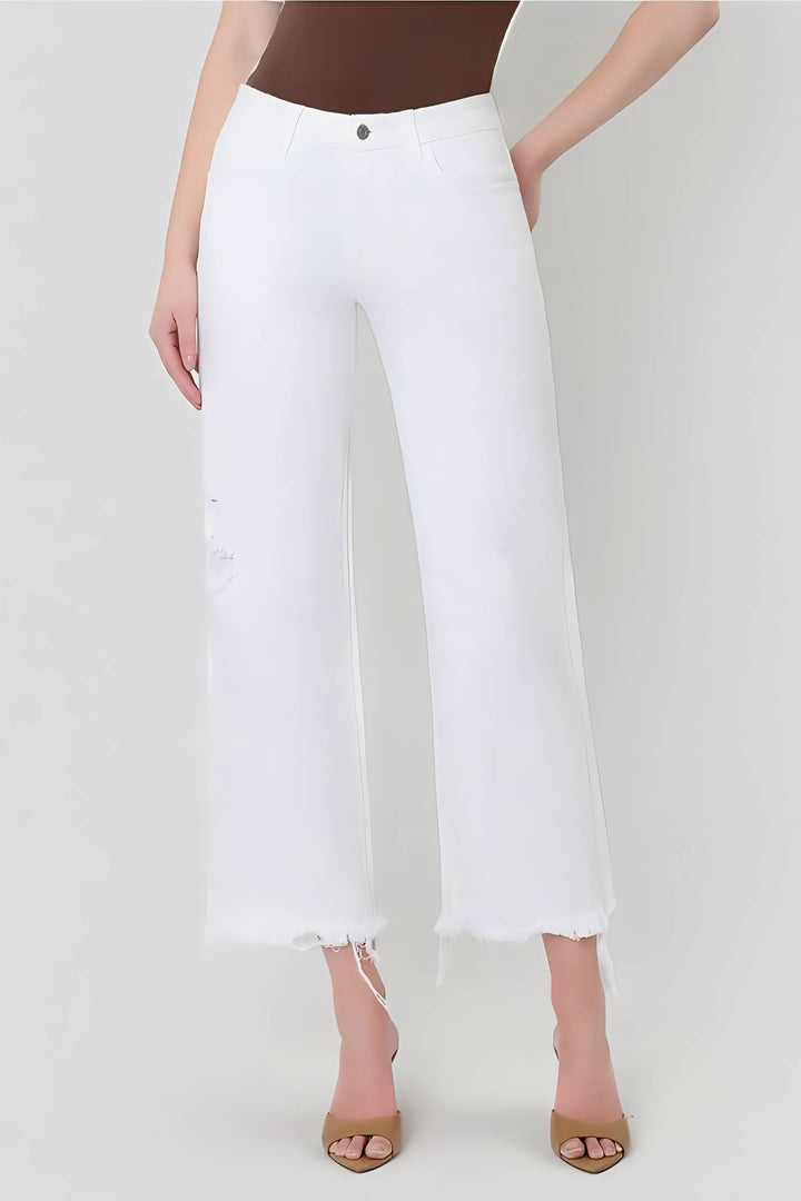 White pants worn by a person on a white background