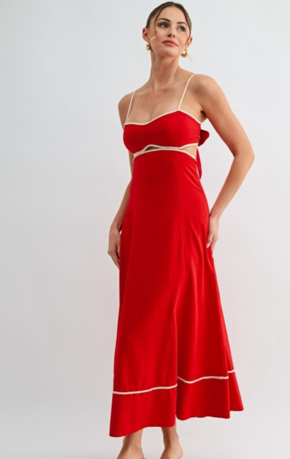Red dress with cut-out design on a white background