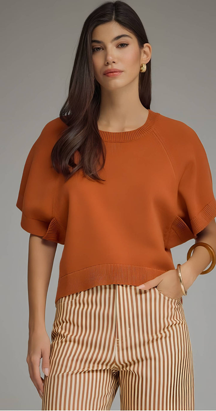 Rust knit top with stripe pants