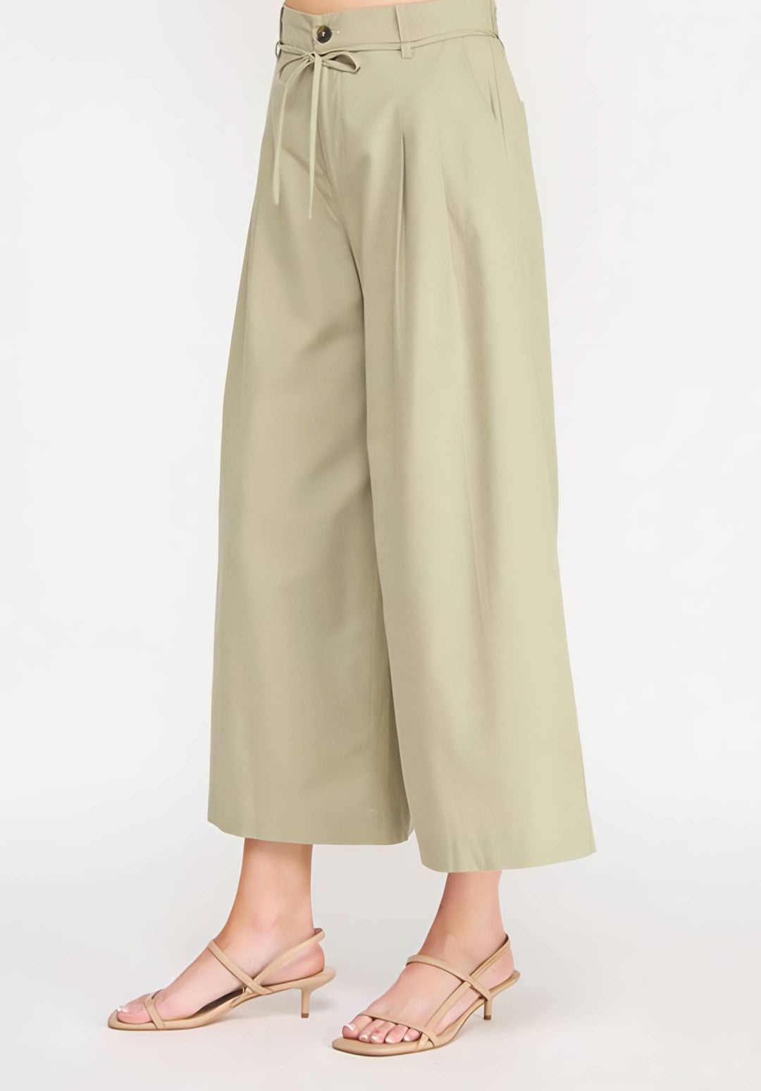 Light green wide-leg pants worn by a person on a white background