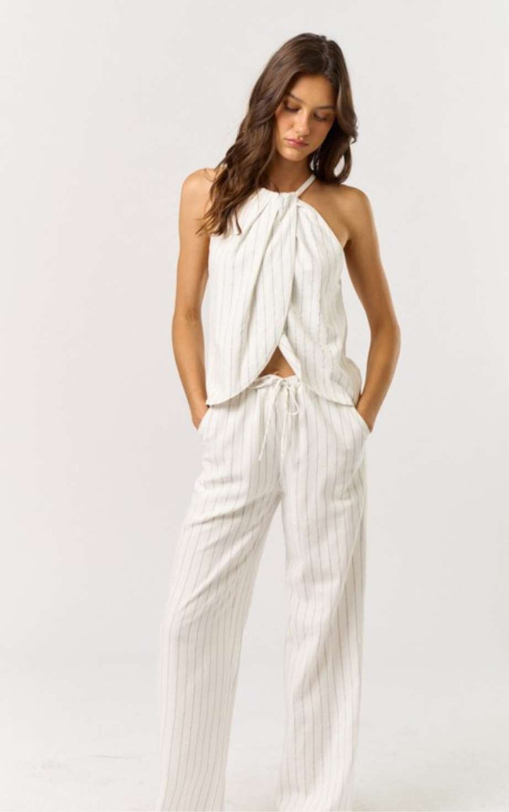 Stripe Halter Top Pant Set - Stylish and trendy two-piece outfit featuring a striped halter top and matching pants, perfect for a chic and comfortable look. Ideal for casual outings or relaxed weekends.