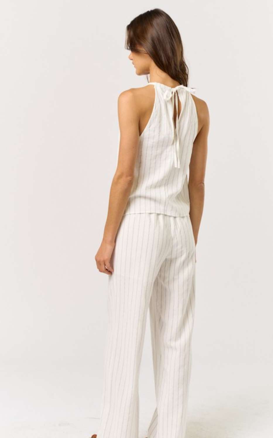 Stripe Halter Top Pant Set - Stylish and trendy two-piece outfit featuring a striped halter top and matching pants, perfect for a chic and comfortable look. Ideal for casual outings or relaxed weekends.
