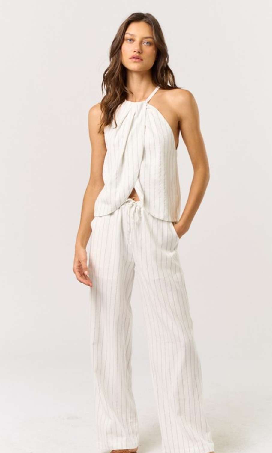 Stripe Halter Top Pant Set - Stylish and trendy two-piece outfit featuring a striped halter top and matching pants, perfect for a chic and comfortable look. Ideal for casual outings or relaxed weekends.