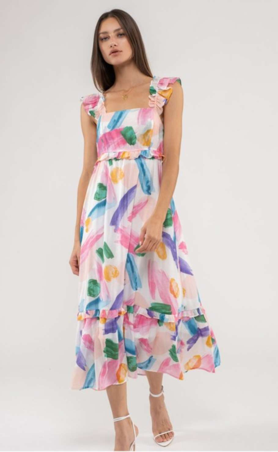 A vibrant pink multi-colored maxi dress featuring a flattering silhouette with a flowing, floor-length skirt, perfect for summer events, casual outings, and stylish occasions.