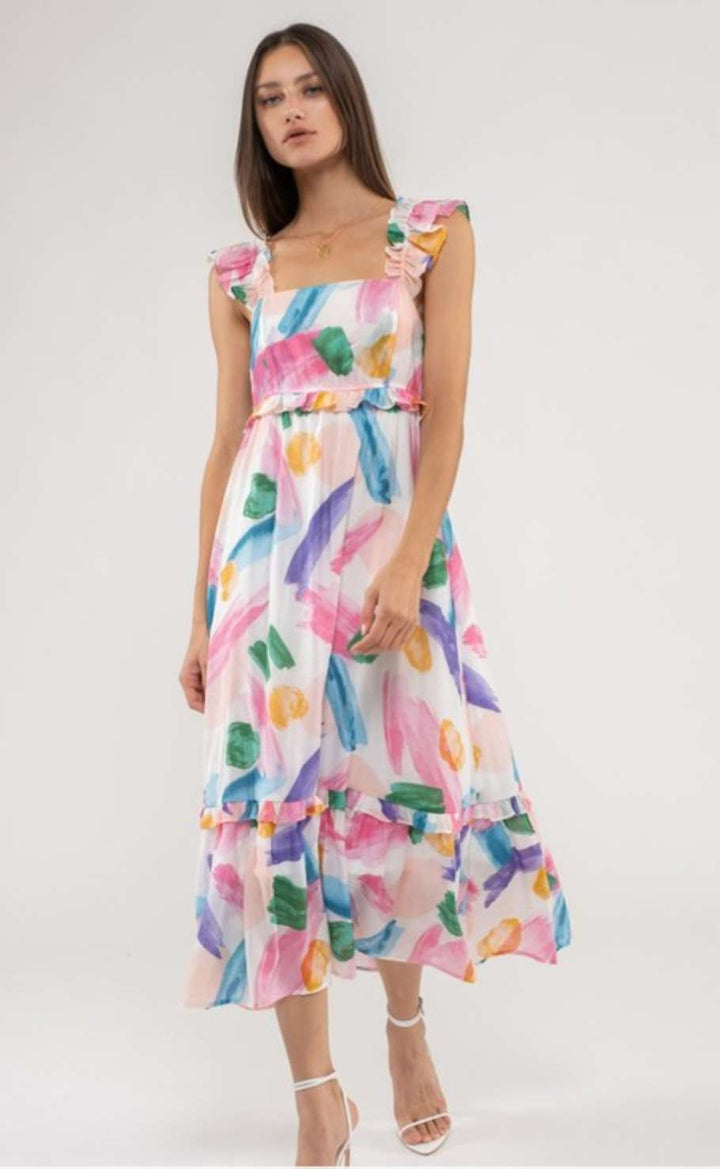 A vibrant pink multi-colored maxi dress featuring a flattering silhouette with a flowing, floor-length skirt, perfect for summer events, casual outings, and stylish occasions.