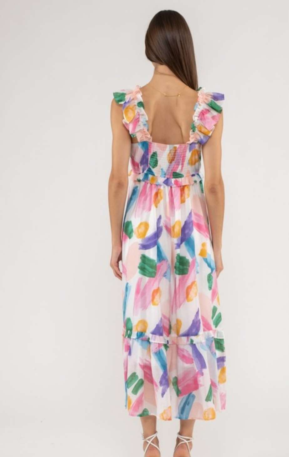 A vibrant pink multi-colored maxi dress featuring a flattering silhouette with a flowing, floor-length skirt, perfect for summer events, casual outings, and stylish occasions.