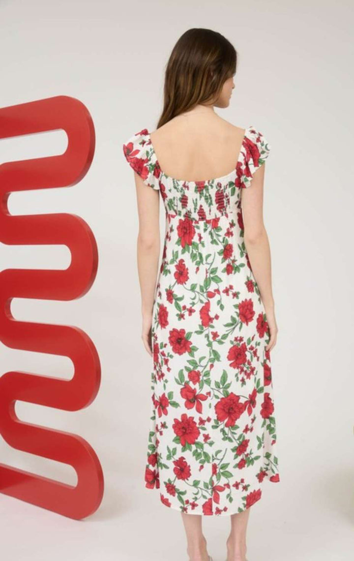 Women's white floral midi dress with soft flowy fabric, sleeveless design, and elegant summer garden party style