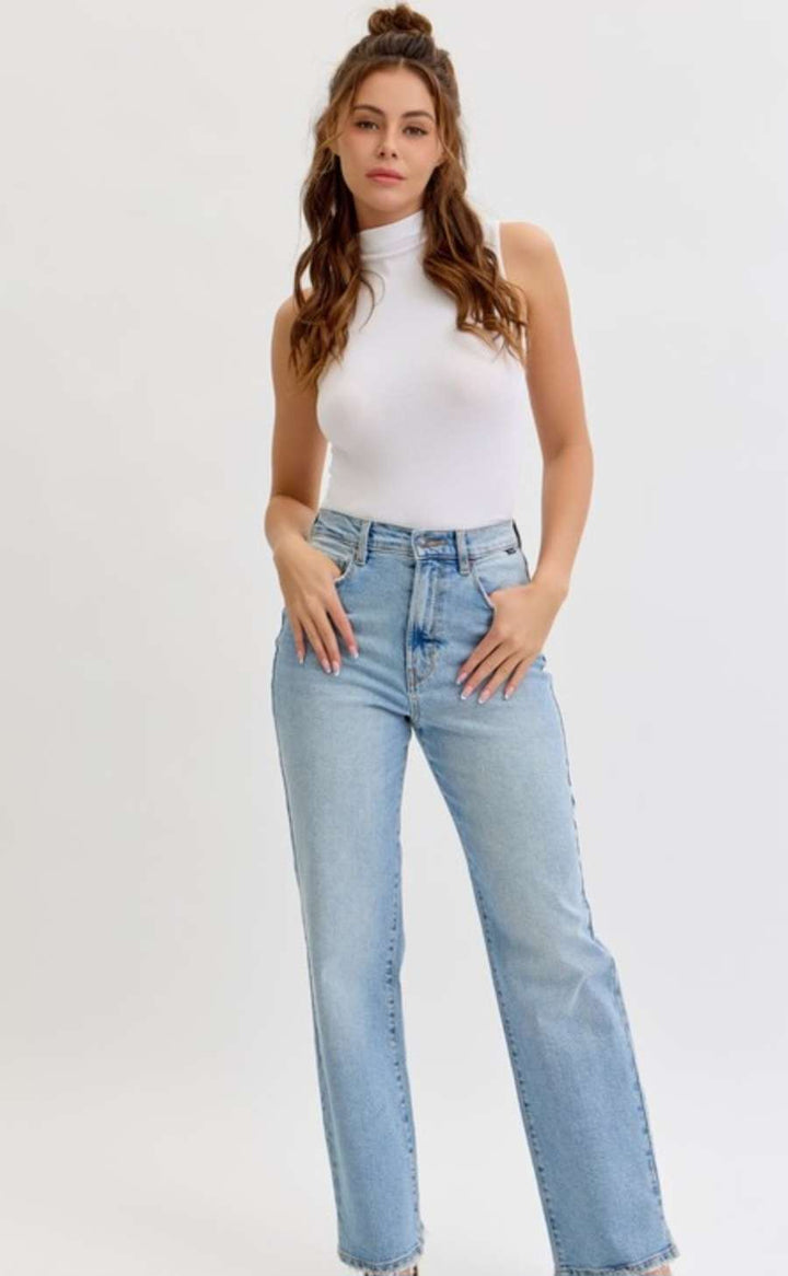 Women's light denim high rise jeans with a slim fit and classic five-pocket design, perfect for casual everyday wear.