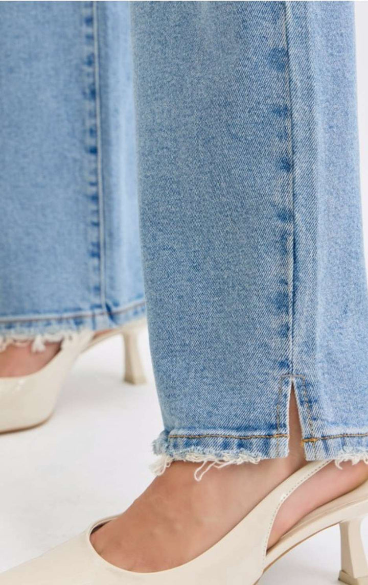 Women's light denim high rise jeans with a slim fit and classic five-pocket design, perfect for casual everyday wear.