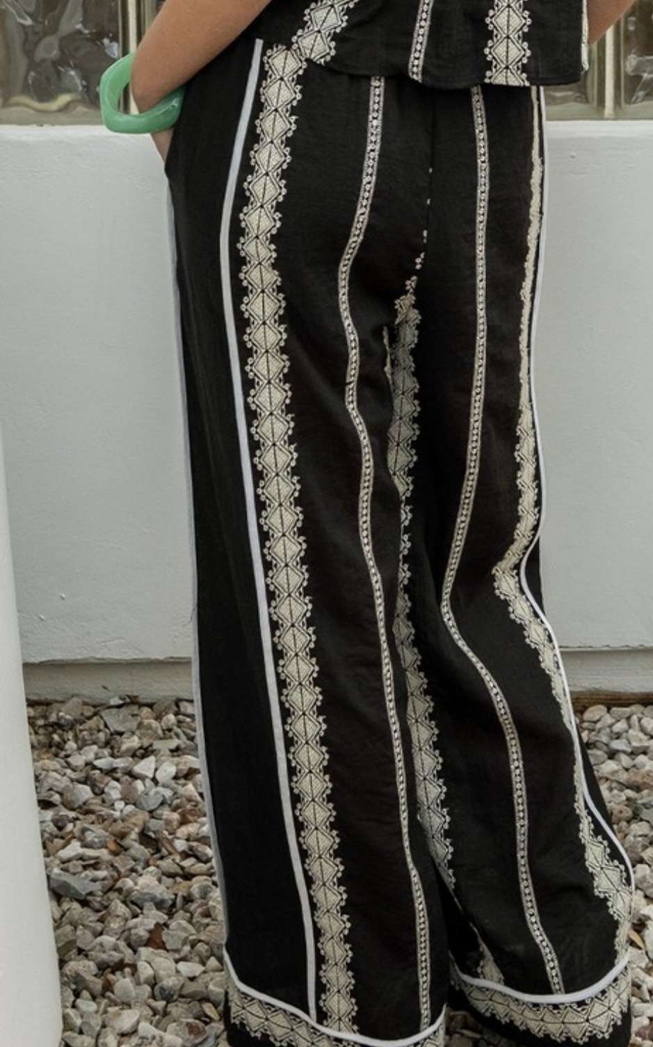 Boho-inspired taupe pants with elastic waistband and decorative embroidery