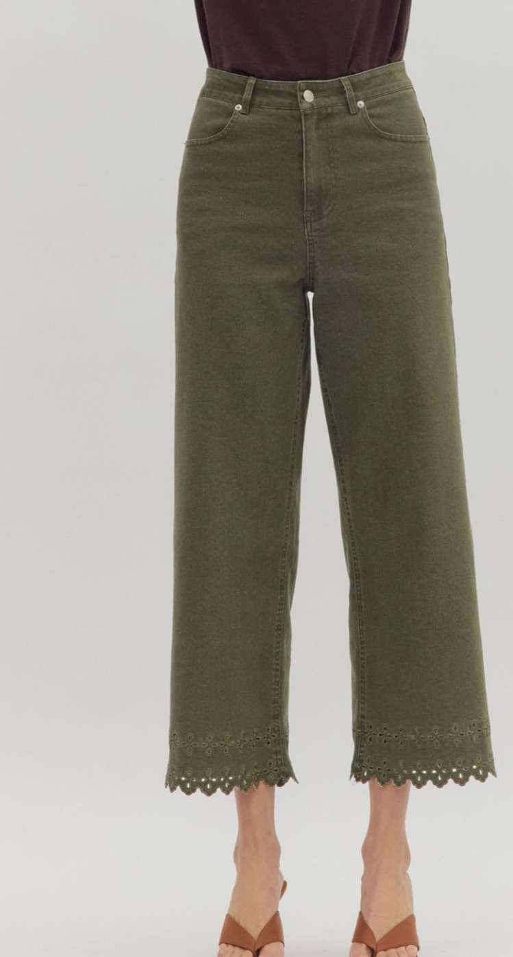 Women's olive green denim pants with eyelet hem detail, stylish high-waisted fit, and ankle-length cut for casual or dressy outfits.